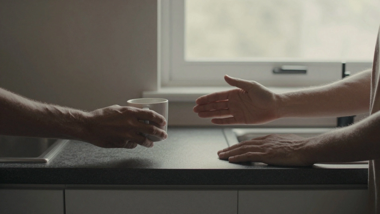 Two hands connecting across a kitchen counter, one offering coffee, the other a gentle touch on the back.